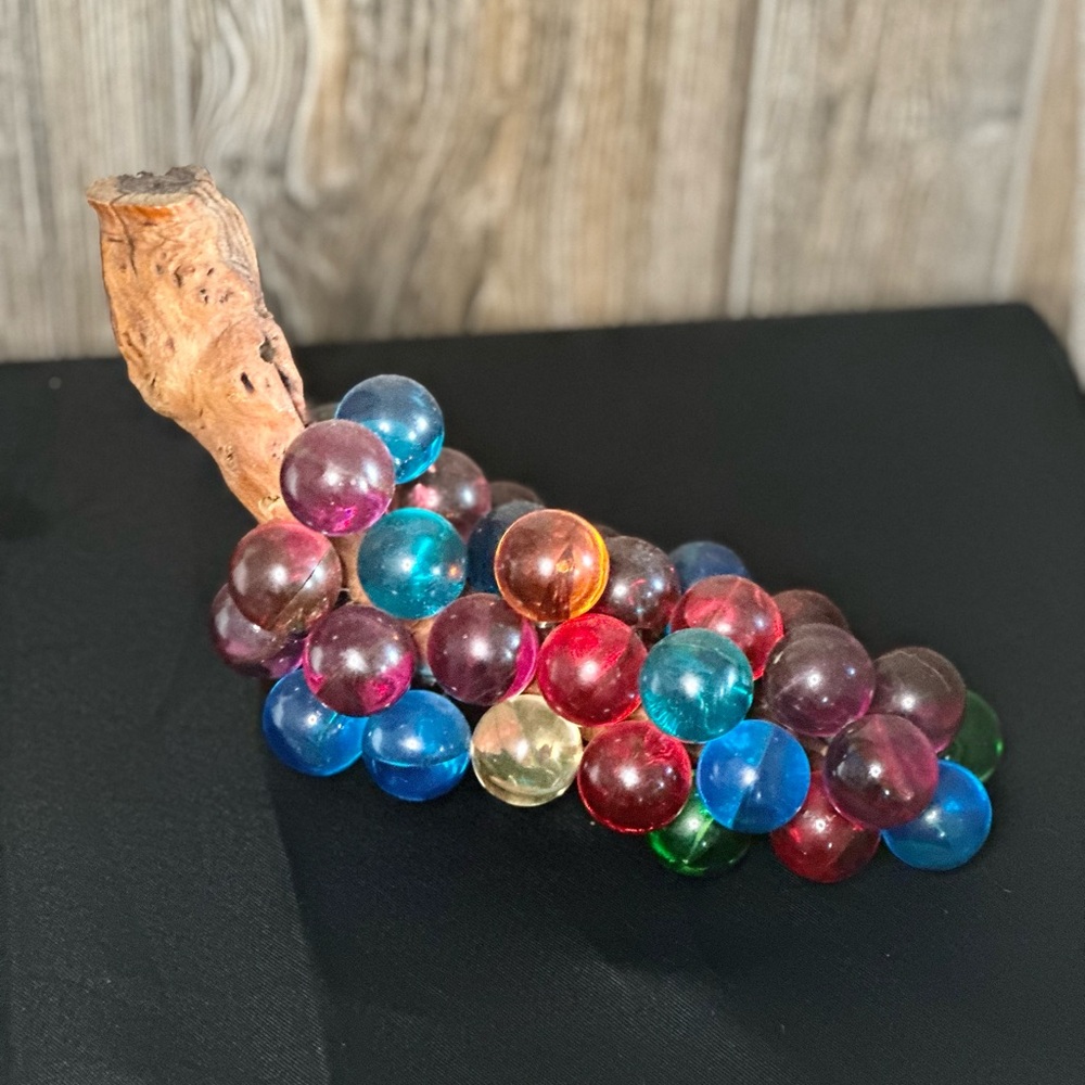 Lucite grapes on driftwood.